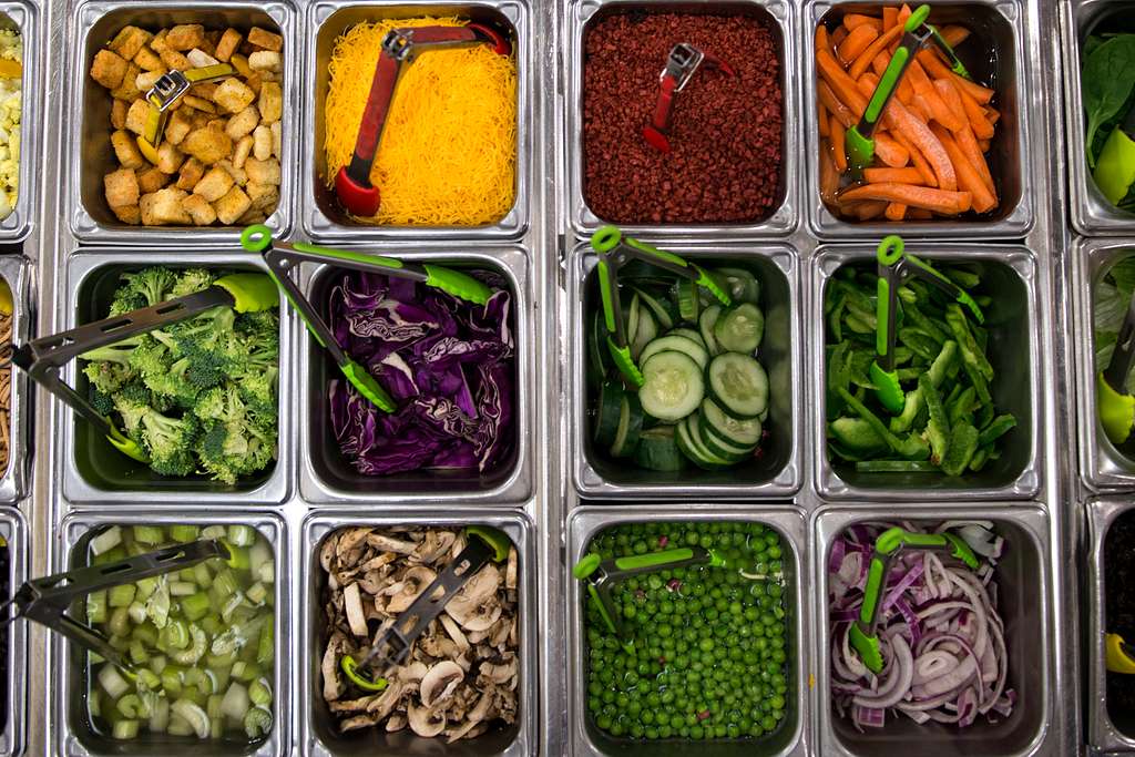 Fresh salad bar with crisp vegetables and greens